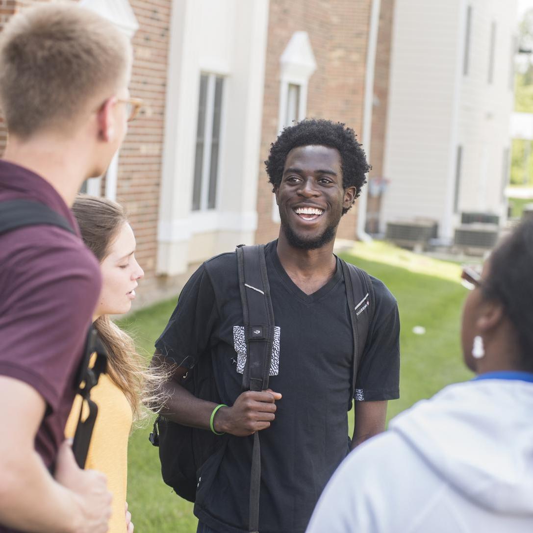 Students talking in a group.